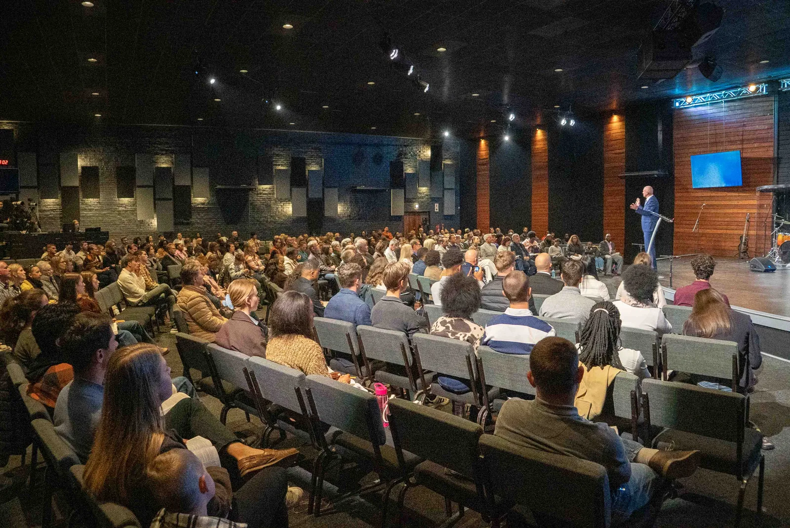 The Sons of Faith family gathered in the auditorium on the opening Sunday