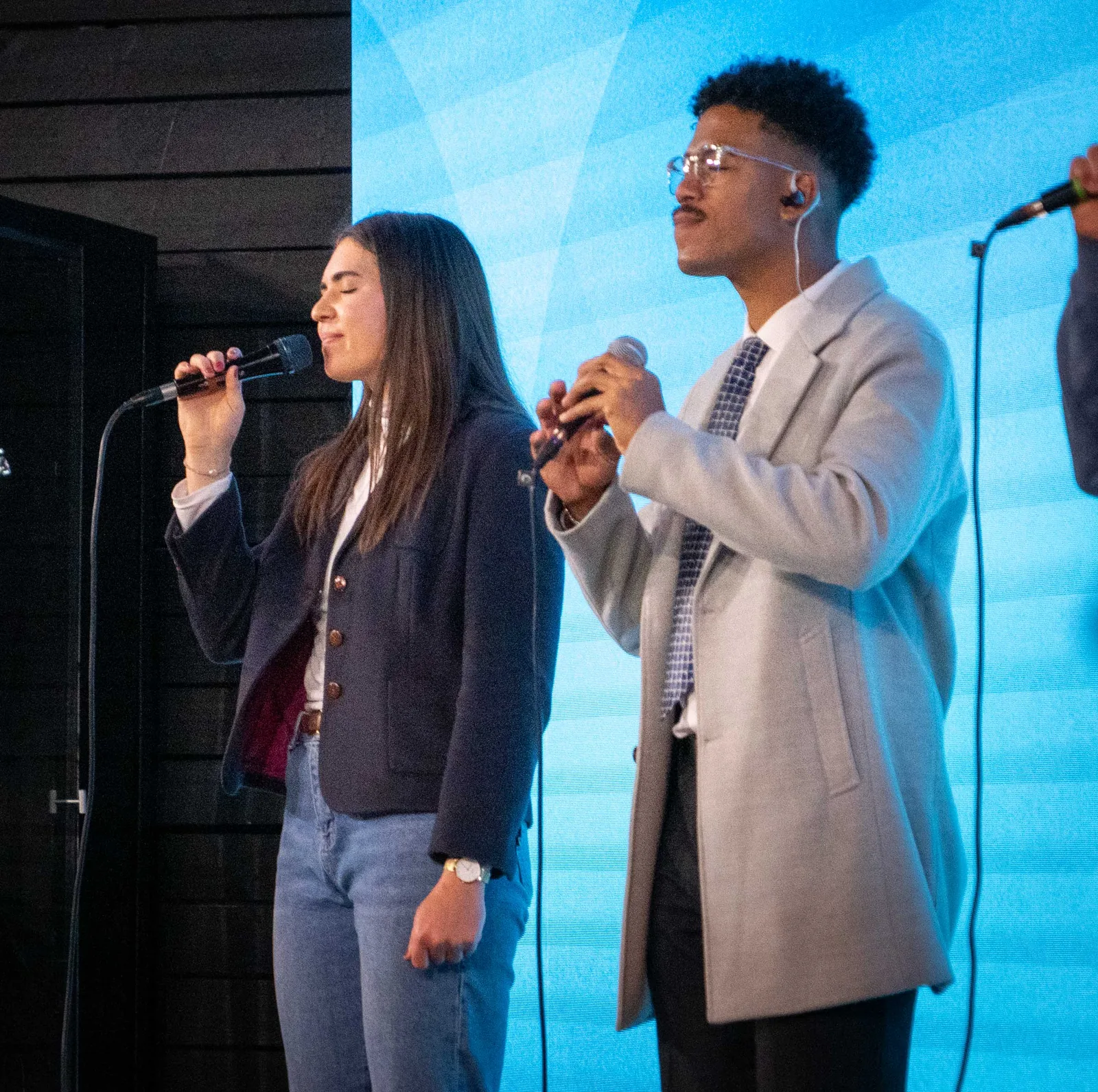 Worship leaders singing on the platform
